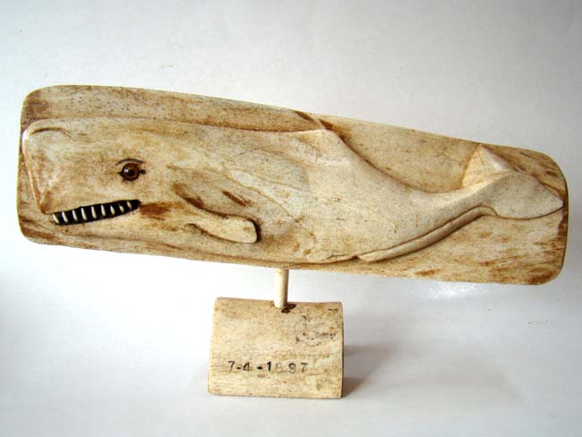 A wonderful carved whalebone depiction of a sperm whale dated July 4, 1897